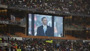 President Obama speaking to attendees of the memorial service Nelson Mandela held in Soweto, 10 December 2013. AP