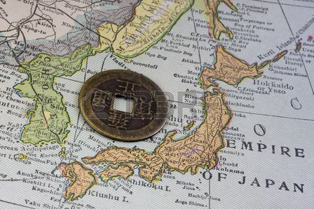 3938923-empire-of-japan-on-a-vintage-map-1926-and-old-japanese-coin-with-square-hole