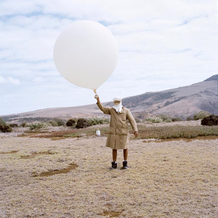 Marcus Henry with his hydrogen filled weather balloon at the Meteorological Station, St Helena CREDIT: JON TONKS