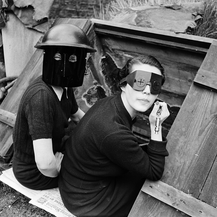 Women in fire masks, Downshire Hill, Hampstead, London, 1941. Photo by Lee Miller.