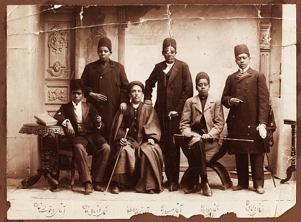  African slaves in Iran during the Qajar era were often eunuchs. Their dress suggests that they belonged to the king or high-ranking members of his court. From right: Aqay-i ‘Almas khan, Aqay-i Bahram khan, Aqay-i Masrur, Aqay-i A Seyid Mustafa, Aqay-i Iqbal khan, and Aqay-i Yaqut khan (different person from other photo), 1880s Photograph: Kimia Foundation