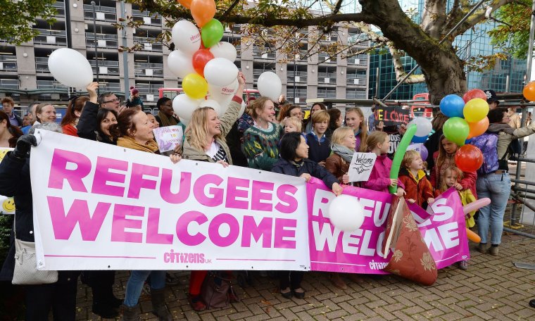 Members of the campaign group Citizens UK hold a ‘refugees welcome’ event outside Lunar House in Croydon. Photograph: John Stillwell/PA